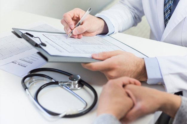 Tablet monitor view over girl shoulder, A Muslim doctor woman is wearing uniform and give consultation to young women, Health care technology concept